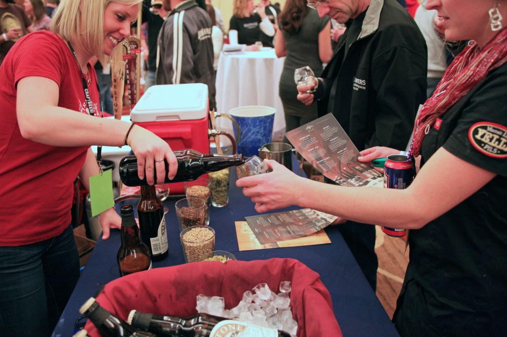 Elizabeth from Firestone Walker pouring a sample of Wookey Jack for an attendee at the Commercial Tasting (from Big Beers, Belgians, & Barleywine site)