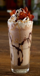 Twist & Shout Shake: Bacardi Oakheart Spiced Rum, Guinness, DeKuyper Dark Creme de Cacao, chocolate syrup, vanilla ice cream and Monin Salted Caramel. Topped with whipped cream, caramel, chocolate syrup, and bacon pieces.