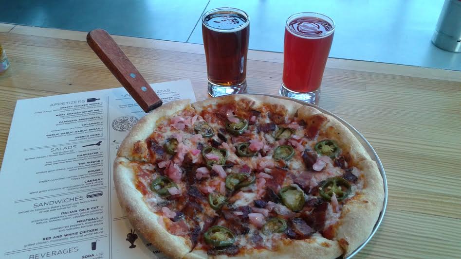 Baconator Pizza: Tender Belly bacon 3-ways: hop sugar bacon, pepper bacon, herb bacon, sour onions, jalapeños, red sauce.