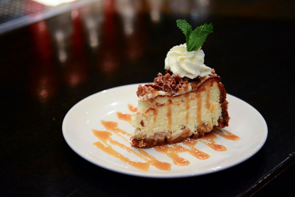 Caramel Apple Cheesecake** Cinnamon graham cracker & pecan crust, brandy glazed Granny Smith apples, pecan streusel, Myers’s Rum caramel sauce and whipped cream